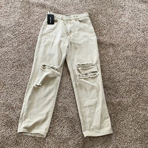 Tan high-waisted, wide-leg, baggy, ripped jeans